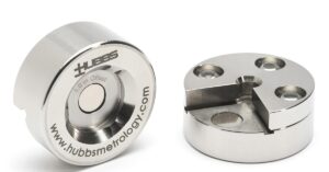 Two polished HUBBS offset adapters. One engraved 1.0 in Offset. The other shows three holes and a cutout.