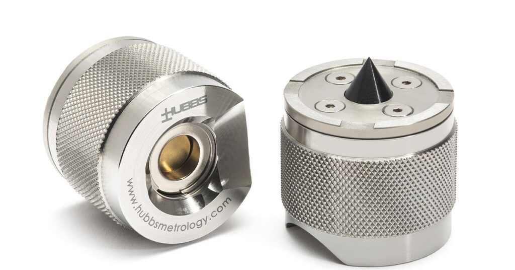 Two knurled HUBBS metal adapters. One shows a gold-lined center bore; the other has a black cone tip.