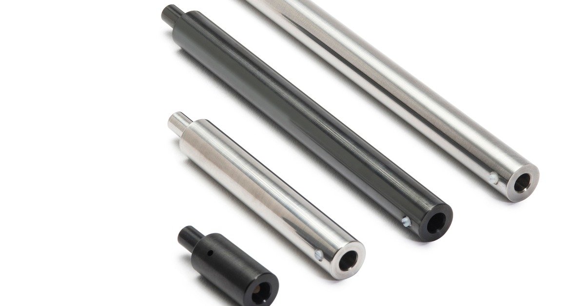 Four black and silver cylindrical metal tools arranged diagonally on a white background with small side screws.
